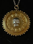 memento mori scalloped pendant