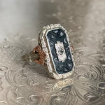 white and rose gold filigree with onyx and diamond ring