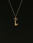 gold love knot key necklace