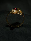 diamond eye & garnet head snake ring