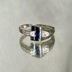 white gold diamond and synthetic sapphire arched ring