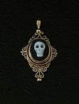 memento mori filigree quatrefoil pendant