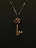 gold love knot key necklace