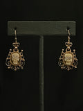 memento mori openwork earrings