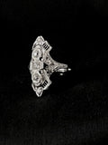 white gold filigree diamond and synthetic sapphire elongated dinner ring