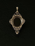 memento mori filigree quatrefoil pendant