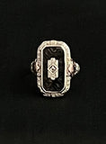 white and rose gold filigree with onyx and diamond ring