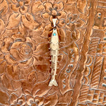 rose gold articulated fish pendant