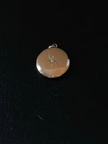 gold diamond circular pendant