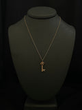 gold love knot key necklace